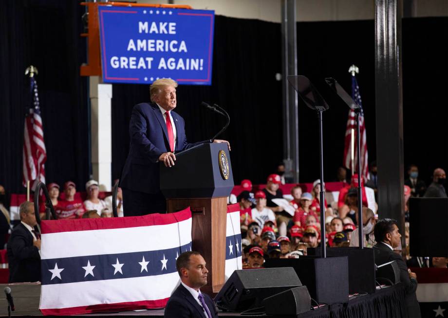 President Donald Trump addresses a large crowd at a campaign rally at Xtreme Manufacturing in H ...