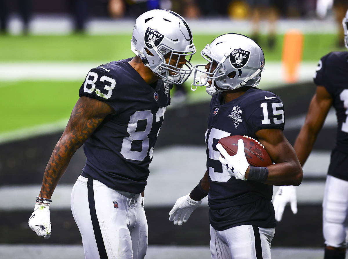 Las Vegas Raiders wide receiver Nelson Agholor (15) celebrates his touchdown with tight end Dar ...