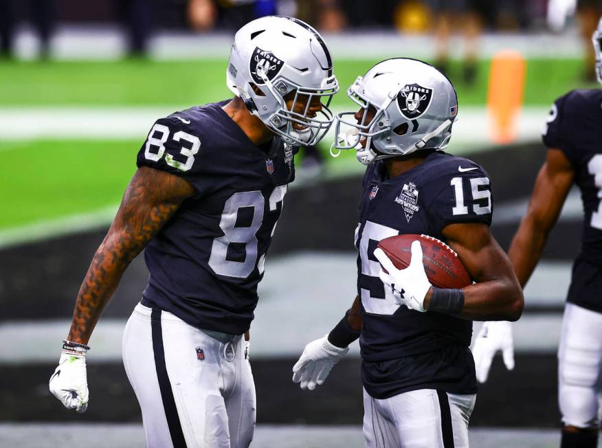 Las Vegas Raiders wide receiver Nelson Agholor (15) celebrates his touchdown with tight end Dar ...