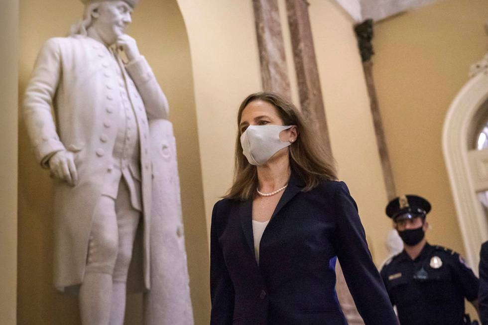 Judge Amy Coney Barrett, President Donald Trump's nominee for the Supreme Court, arrives for cl ...