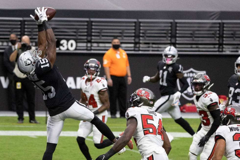 Las Vegas Raiders wide receiver Nelson Agholor (15) makes a touchdown catch over Tampa Bay Bucc ...