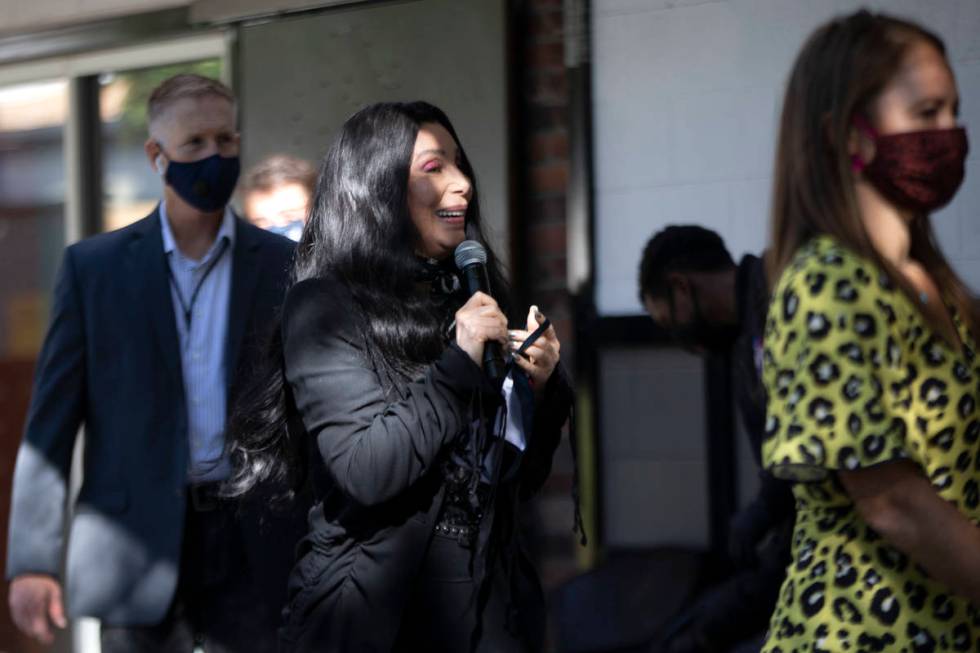 Cher walks on stage to campaign for Joe Biden and Kamala Harris at an event geared toward the L ...