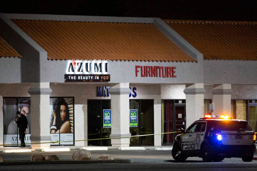 Metropolitan police investigate a homicide at a business near 3603 North Las Vegas Boulevard on ...