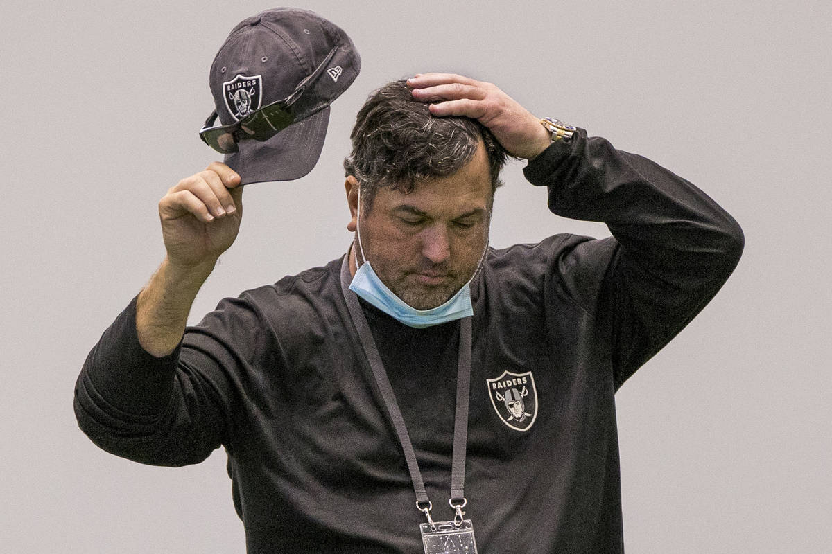Las Vegas Raiders defensive coordinator Paul Guenther takes a moment to consider things during ...