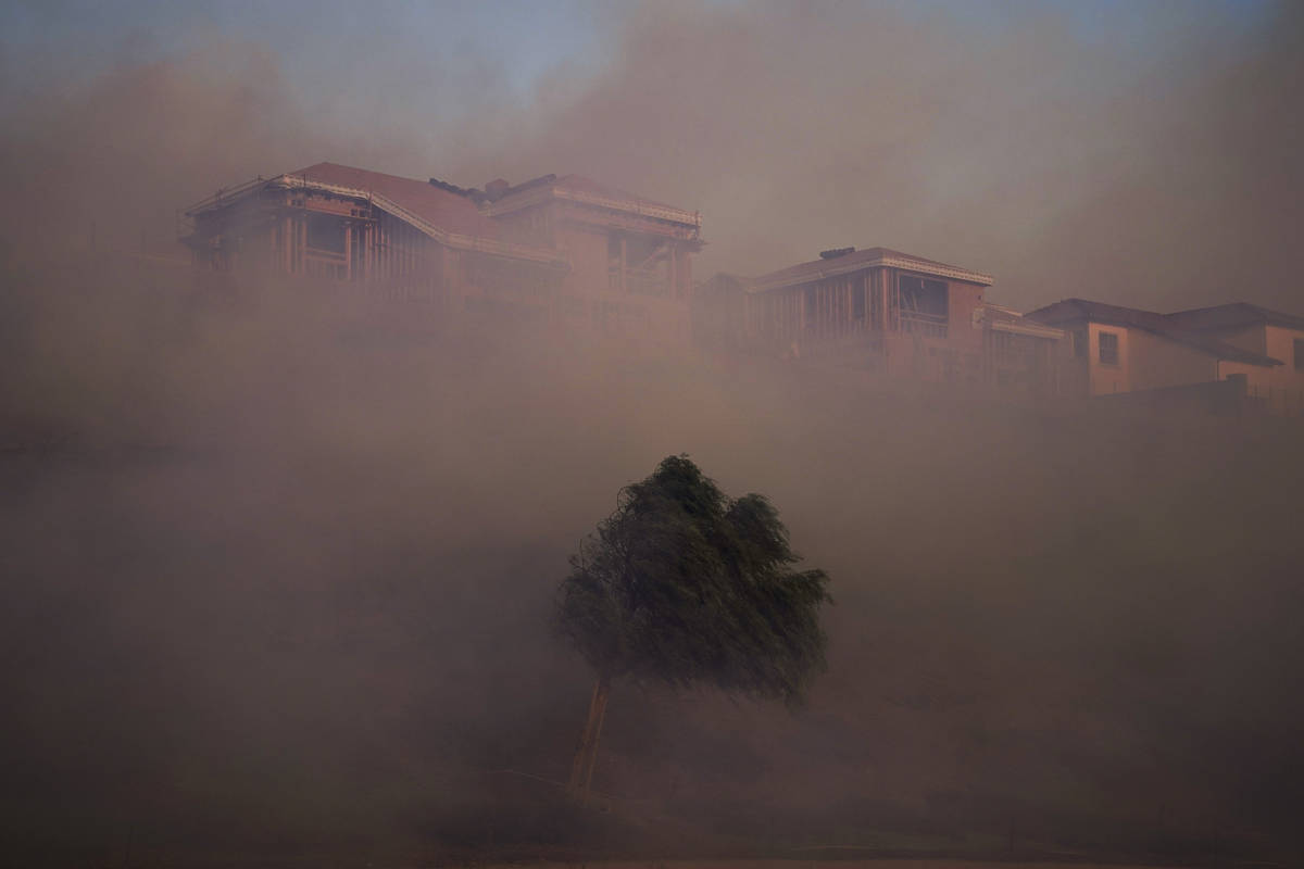 Gusting winds carry smoke from the Silverado Fire into residential areas Monday, Oct. 26, 2020, ...