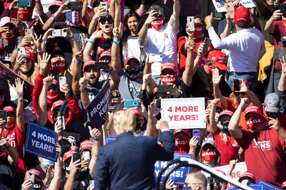 Supporters cheer as President Donald Trump speaks during Make America Great Again victory rally ...