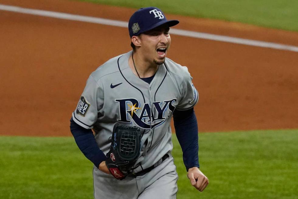 Tampa Bay Rays starting pitcher Blake Snell celebrates after striking out the side during the f ...