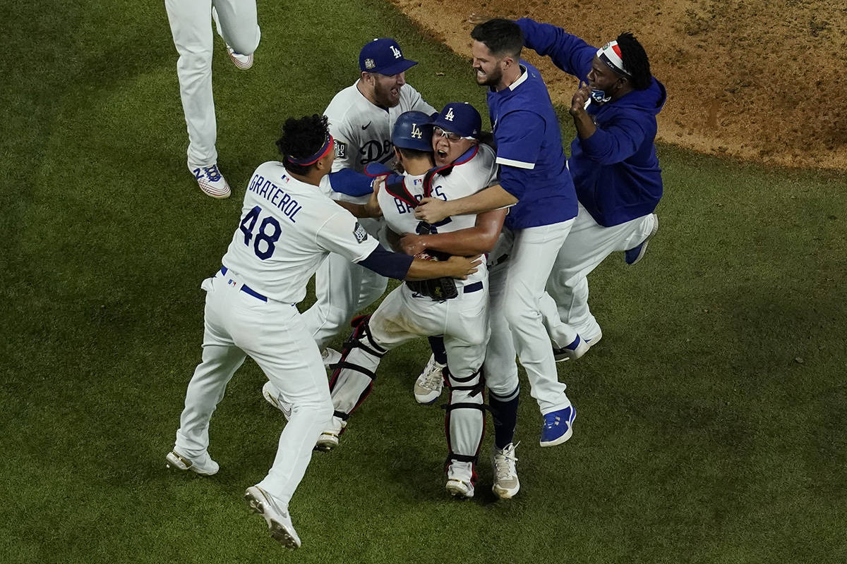 Los Angeles Dodgers celebrate after defeating the Tampa Bay Rays 3-1 to win the baseball World ...