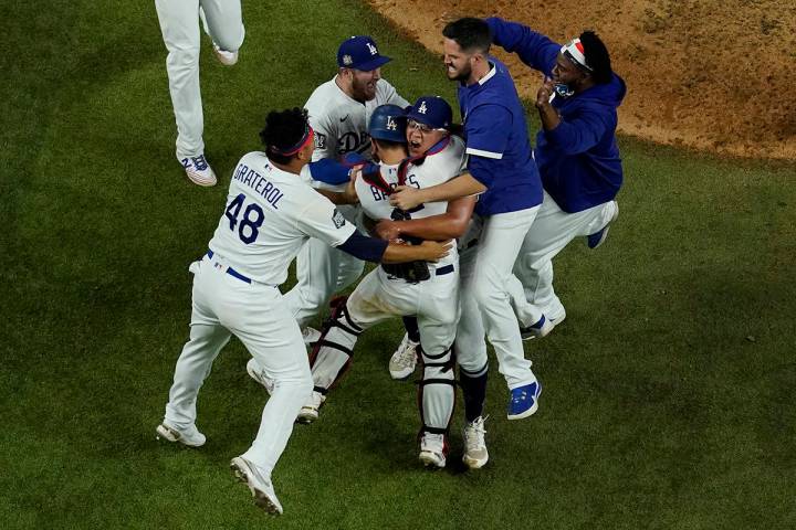 Los Angeles Dodgers celebrate after defeating the Tampa Bay Rays 3-1 to win the baseball World ...