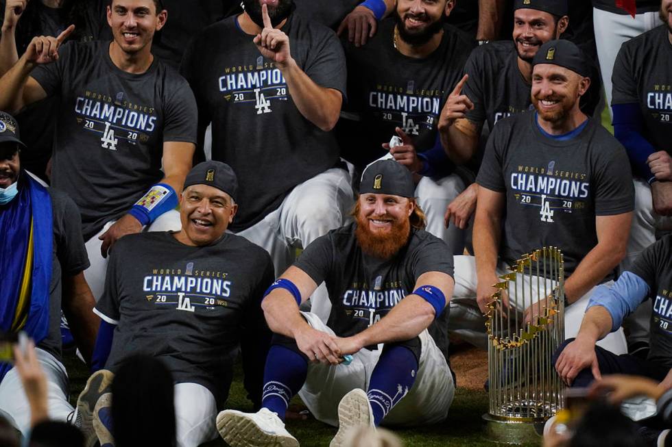 Los Angeles Dodgers manager Dave Roberts and third baseman Justin Turner pose for a group pictu ...