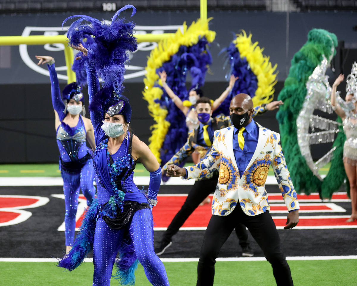 Las Vegas performers, including Chelsea Dee, front, put on a show at Allegiant Stadium as part ...