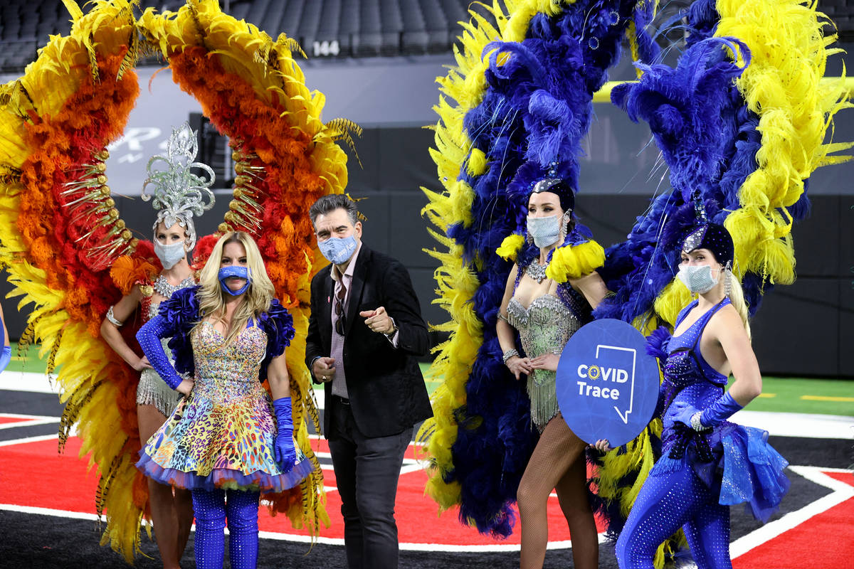John Katsilometes, center, poses with Las Vegas performers, from left, Jennifer Jordan, Lily Ac ...