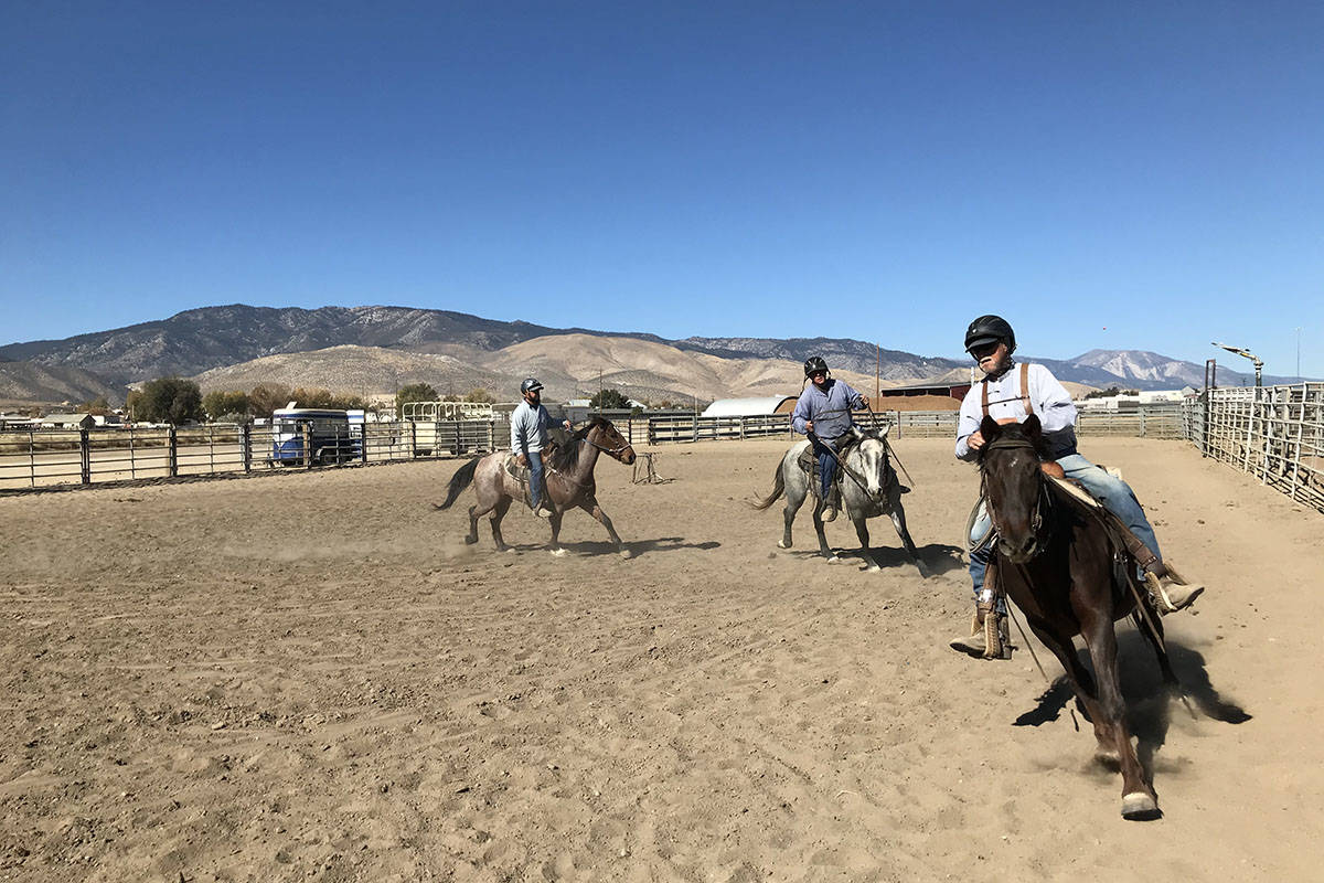 Inmates in the wild horse program at Stewart Conservation Camp work with their horses Tuesday, ...