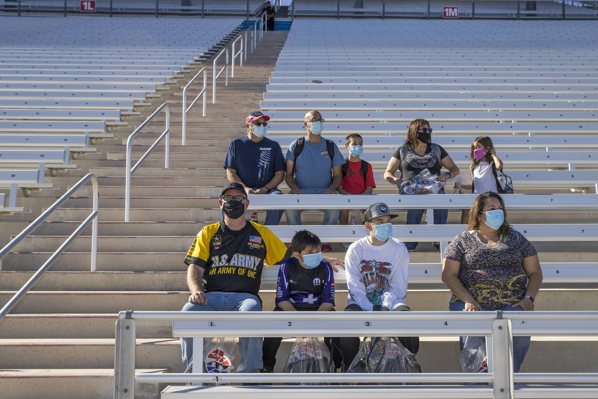 (From bottom) The Roberts and Jaramillo families sit in the stands about the track as the Las V ...