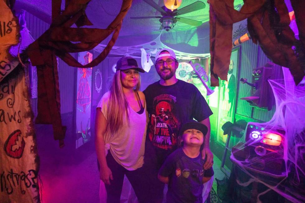 Tiffany Garcia, left, Leroy Garcia, center, and their son Logan, 6, is seen in their DIY Haunte ...