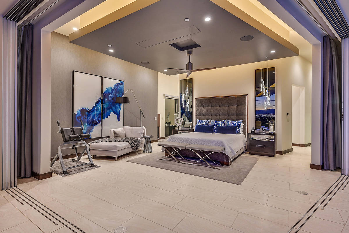 The master bedroom opens to the pool area. (Huntington and Ellis)
