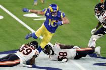 Los Angeles Rams wide receiver Cooper Kupp, top, leaps over Chicago Bears inside linebacker Dan ...