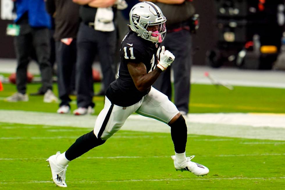 Las Vegas Raiders wide receiver Henry Ruggs III (11) runs the ball after a catch against the Ta ...