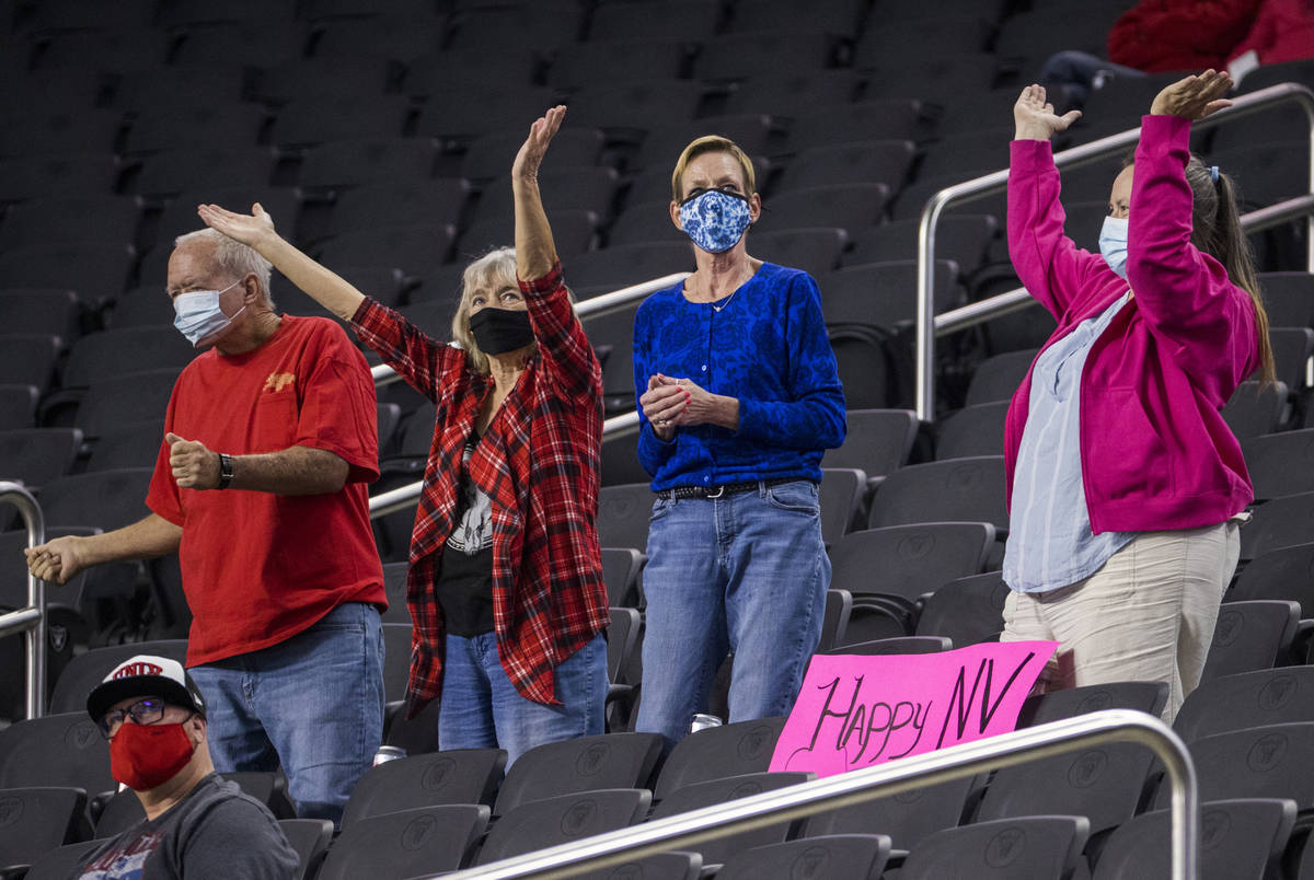 Fans dance in the stands during the second half of the UNLV Rebels versus the Nevada Wolf Pack ...