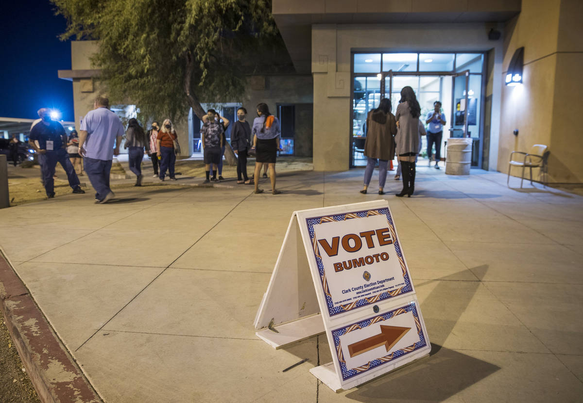 A line wraps around the entrance during the last night of early voting at the East Las Vegas Co ...
