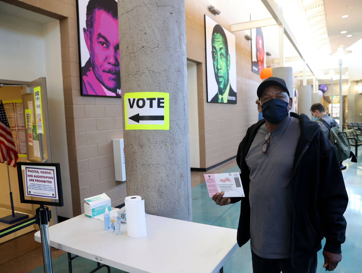 Donald Prentiss, 60, of Las Vegas prepares to drop off his ballot on the last day of early voti ...