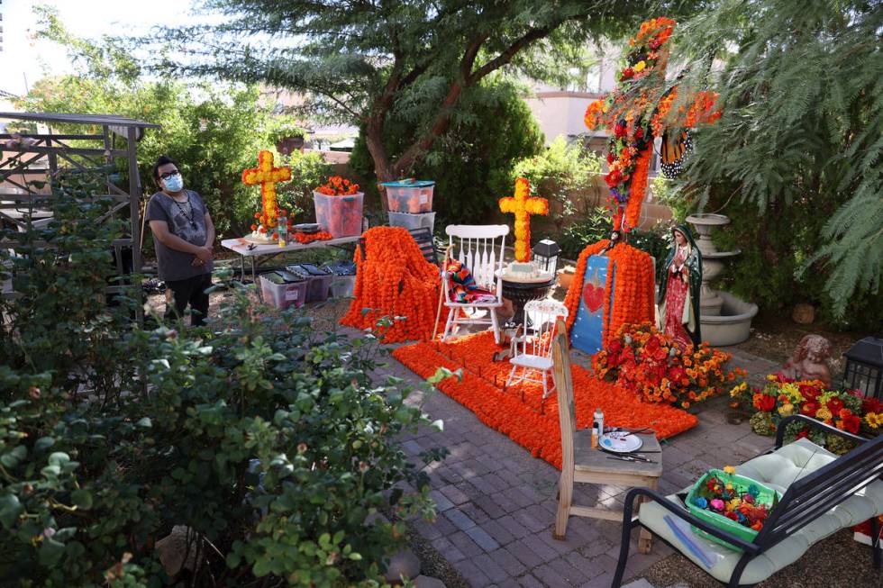 Isaias Urrabazo stands next to his Dia de los Muertos altar at his home in Las Vegas, Saturday, ...
