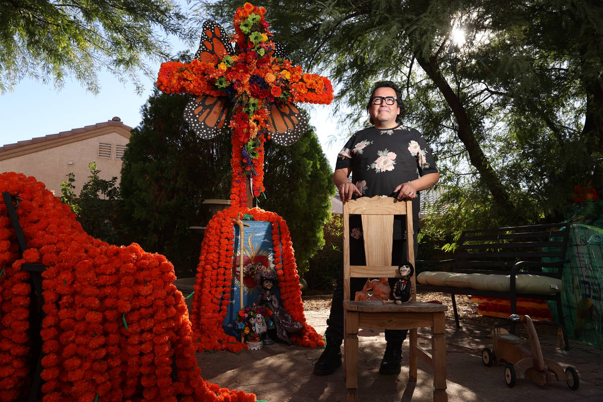 Isaias Urrabazo, poses for a portrait next to an altar he created at his home in Las Vegas, Wed ...