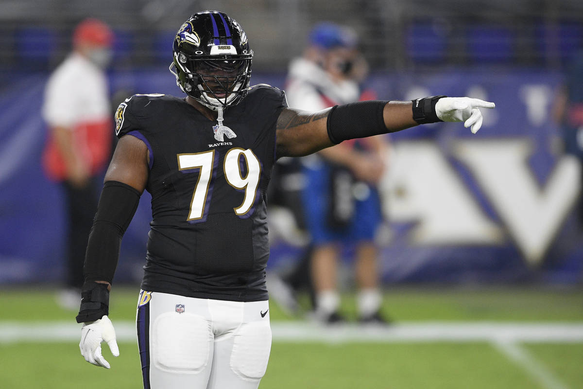 Baltimore Ravens offensive tackle Ronnie Stanley (79) points during the first half of an NFL fo ...