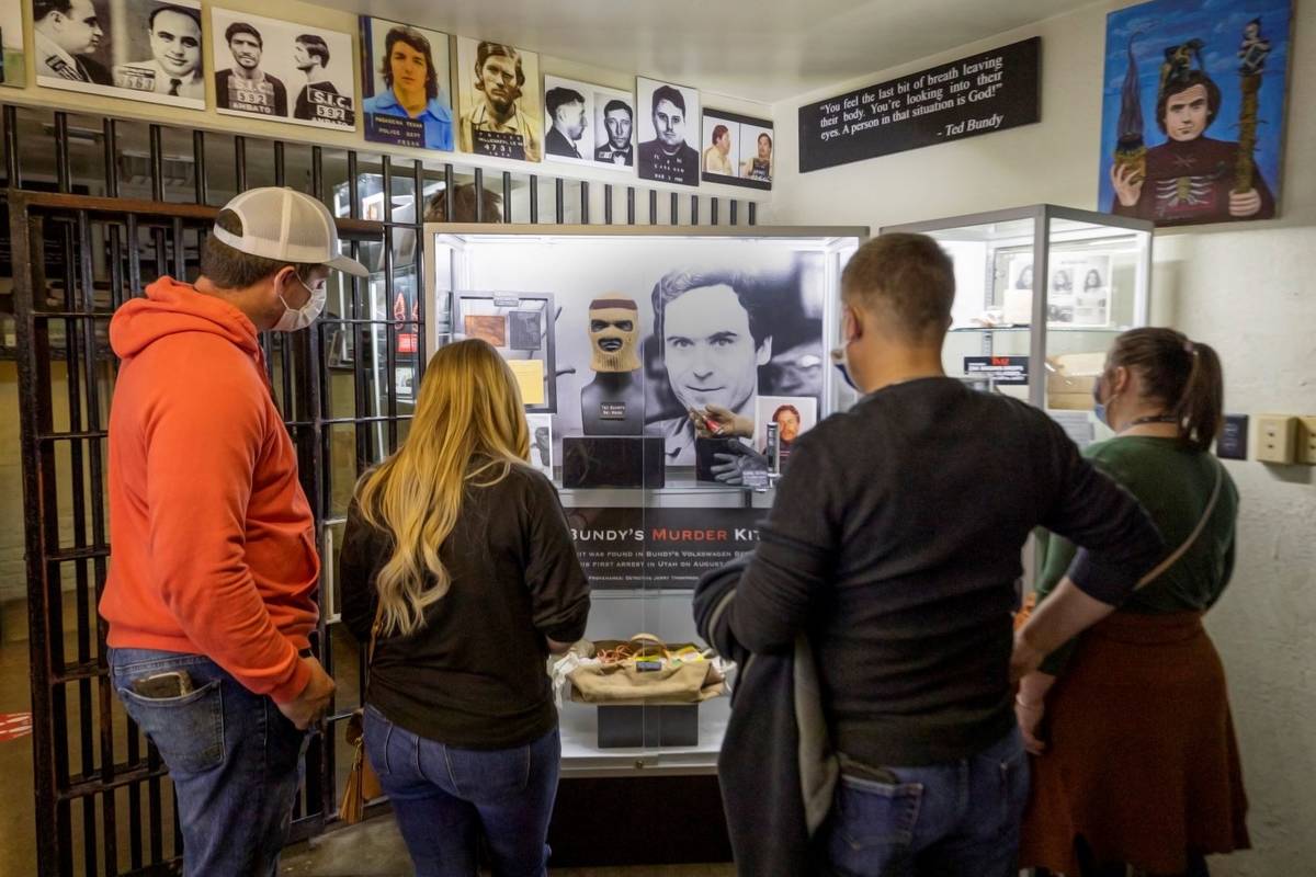 Tourists from Jackson, Georgia, look at belongings from Ted Bundy during a tour of Zak Bagans' ...