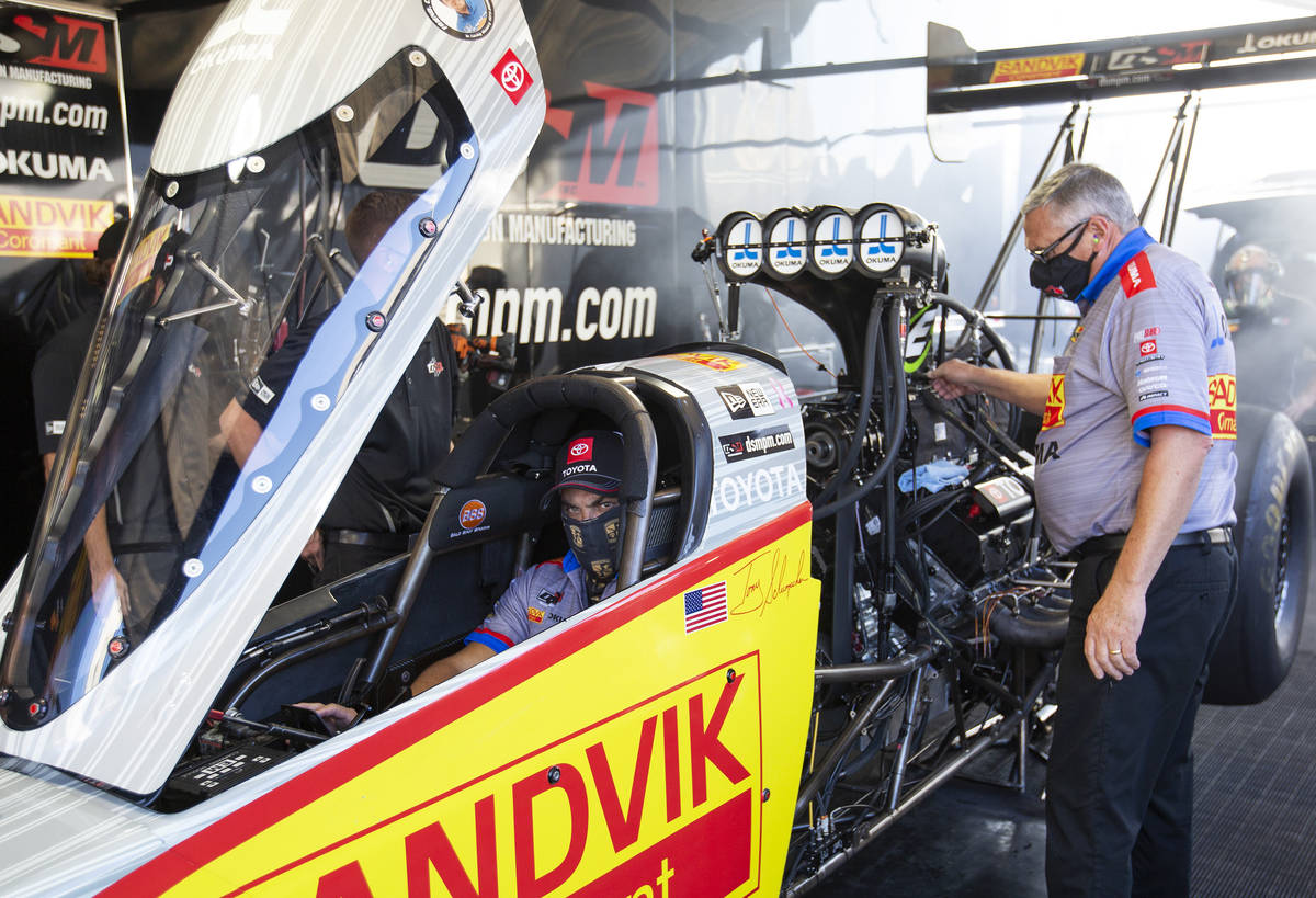 Top Fuel driver Tony Schumacher warms up his car before racing in the qualifying round of the D ...