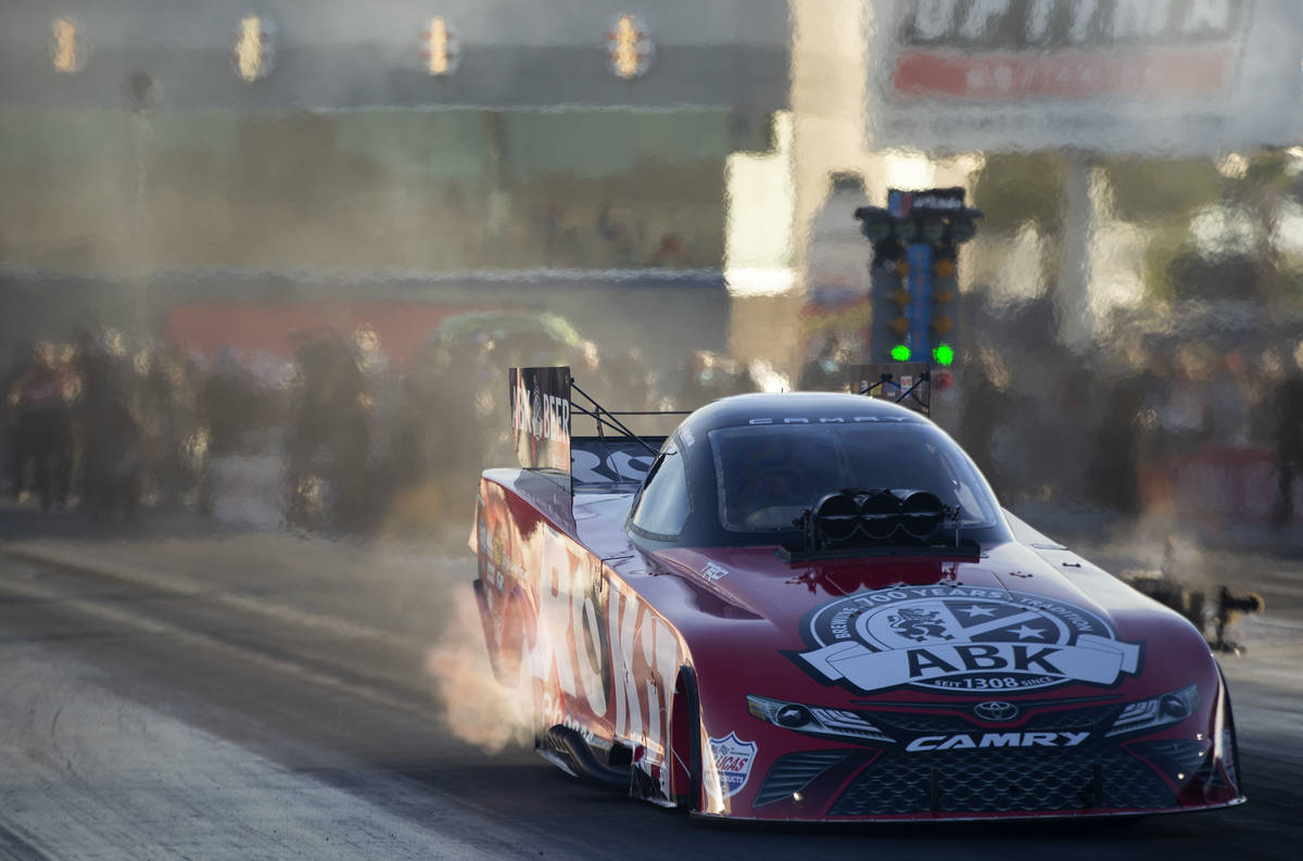 Funny Car racer Alexis DeJoria drives in the Dodge NHRA Finals at Las Vegas Motor Speedway on S ...