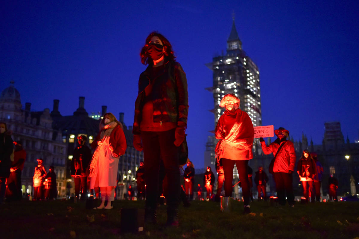 Demonstrators hold a silent vigil in Parliament Square to rise awareness on entertainment and a ...