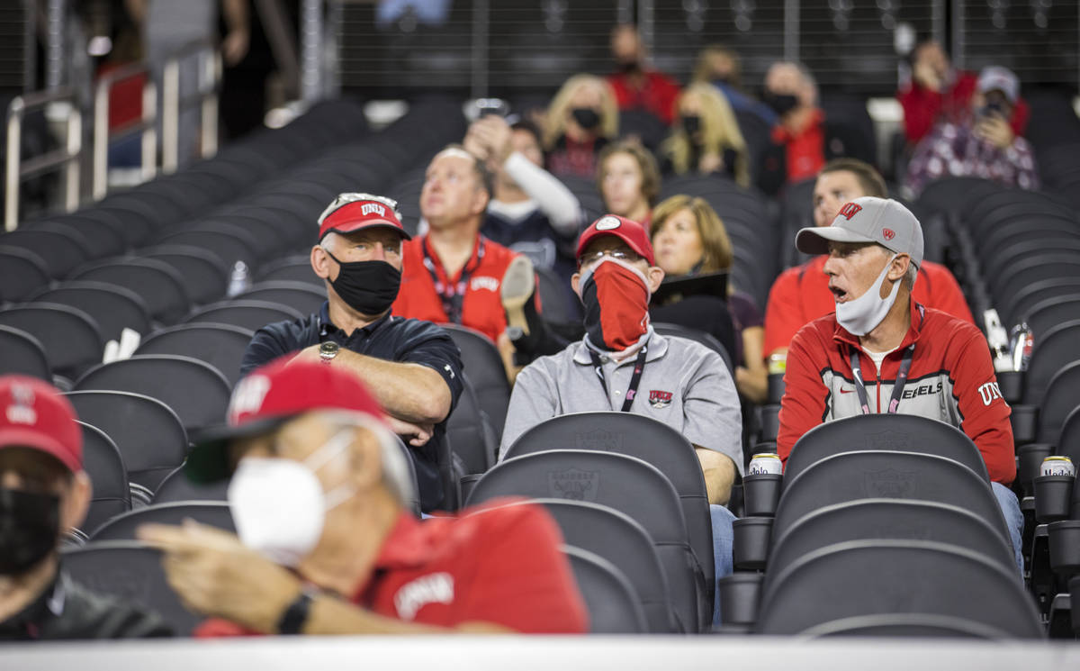 Fans chat during a lull in the UNLV Rebels versus the Nevada Wolf Pack game during the first ha ...