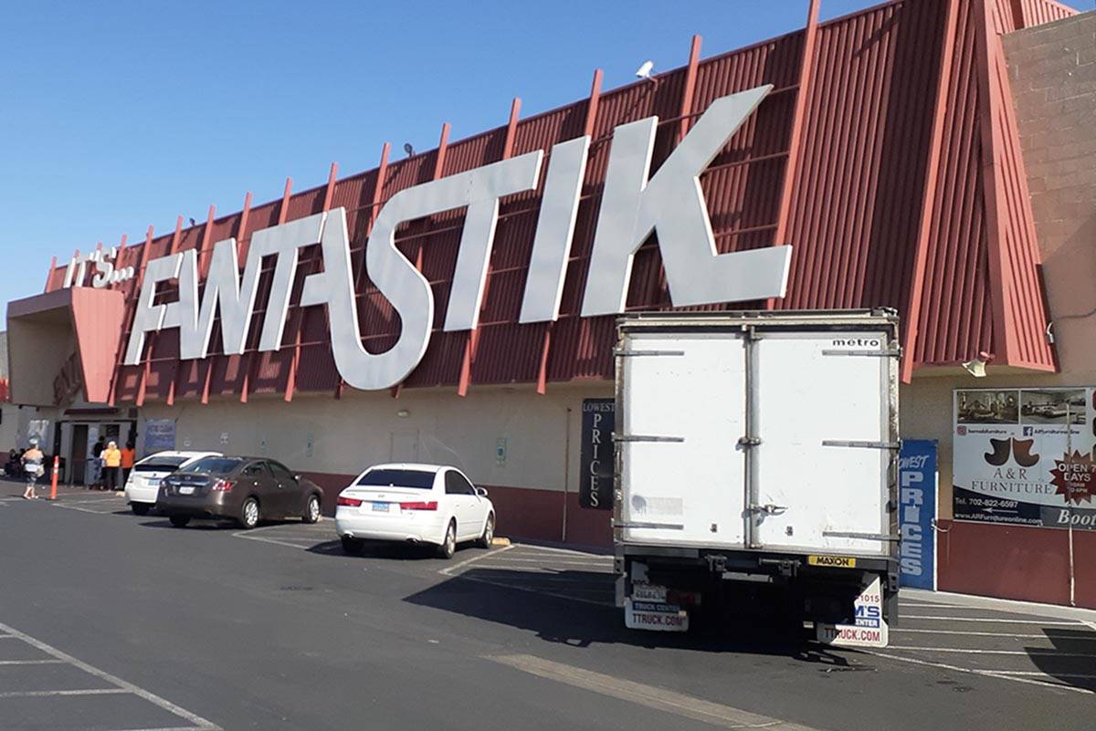 With a sign from a former furniture manufacturing company already on the building, the swap mee ...