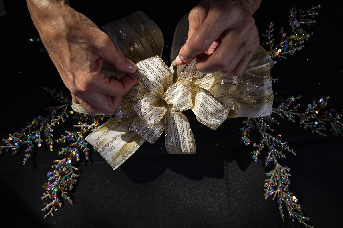 Sandy Sadler creates a bow at her home in Henderson using the Bowdabra device she invented. (Ra ...