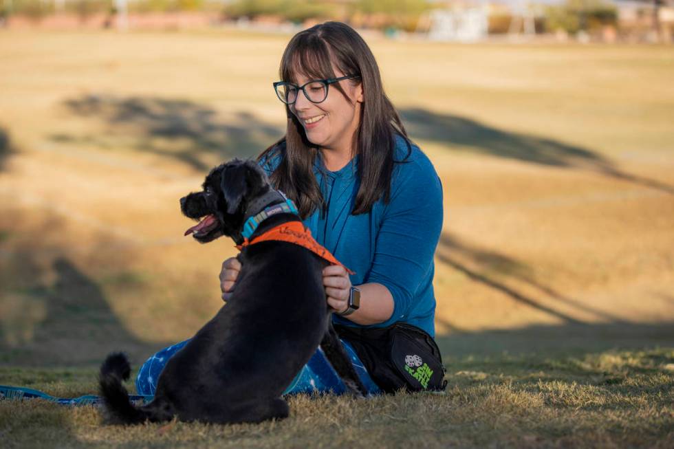 Rachel DiNola, a registered nurse and volunteer, is seen with her dog Izzy, at Mountain's Edge ...