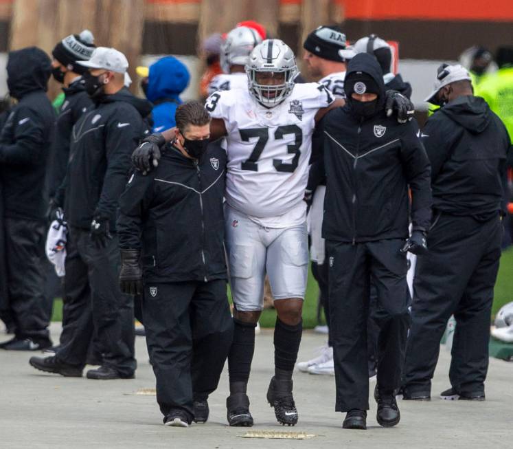 Las Vegas Raiders defensive tackle Maurice Hurst (73) is helped off the field following an inju ...