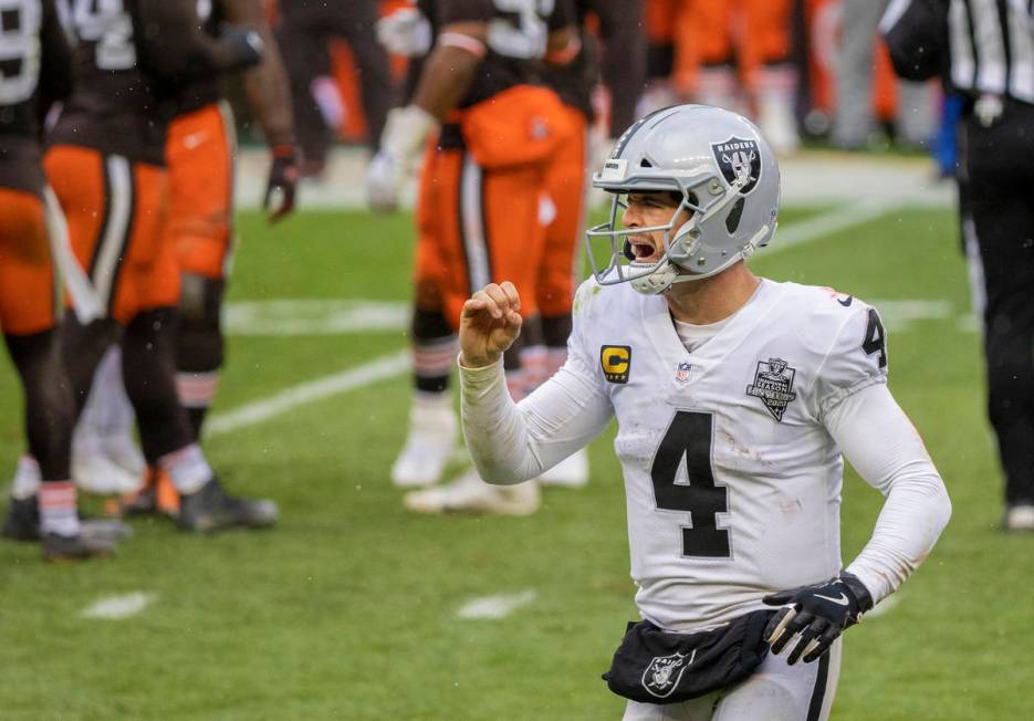 Las Vegas Raiders quarterback Derek Carr (4) celebrates a big play in the fourth quarter during ...