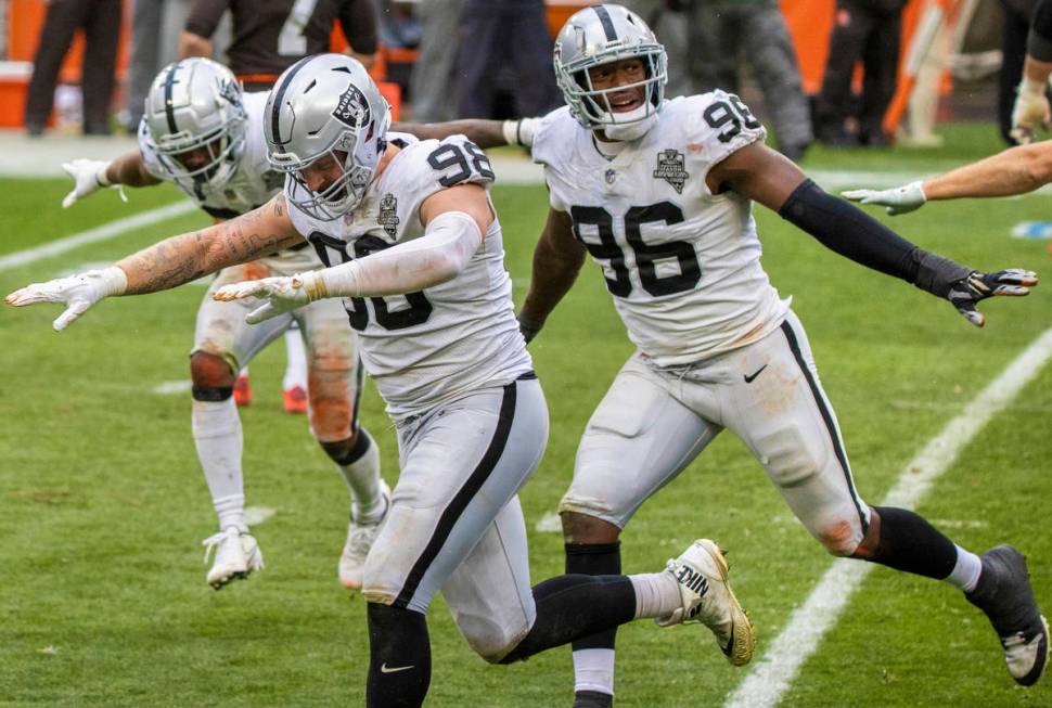 Las Vegas Raiders defensive end Maxx Crosby (98) and Las Vegas Raiders defensive end Clelin Fer ...