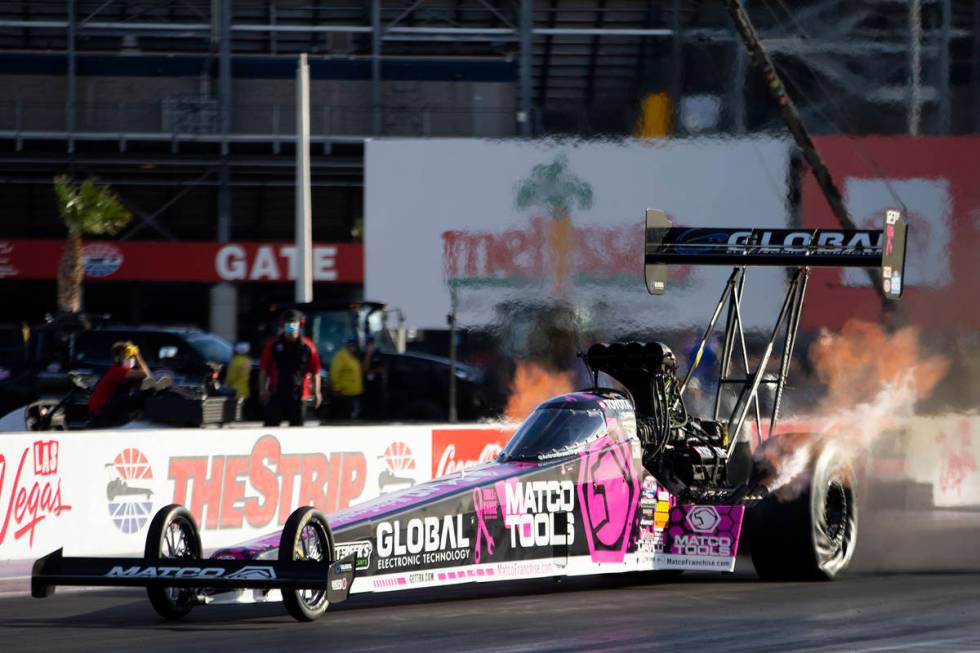 Top Fuel driver Antron Brown races during the Dodge NHRA Finals at Las Vegas Motor Speedway on ...