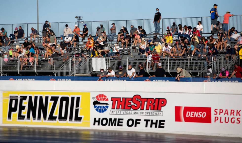 Fans watch as the Dodge NHRA Finals are underway at Las Vegas Motor Speedway on Sunday, Nov. 1, ...