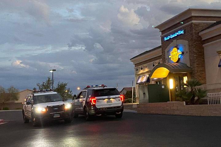 Las Vegas police vehicles at a PTs Gold on the 5600 block of South Hualapai Way in west Las Veg ...