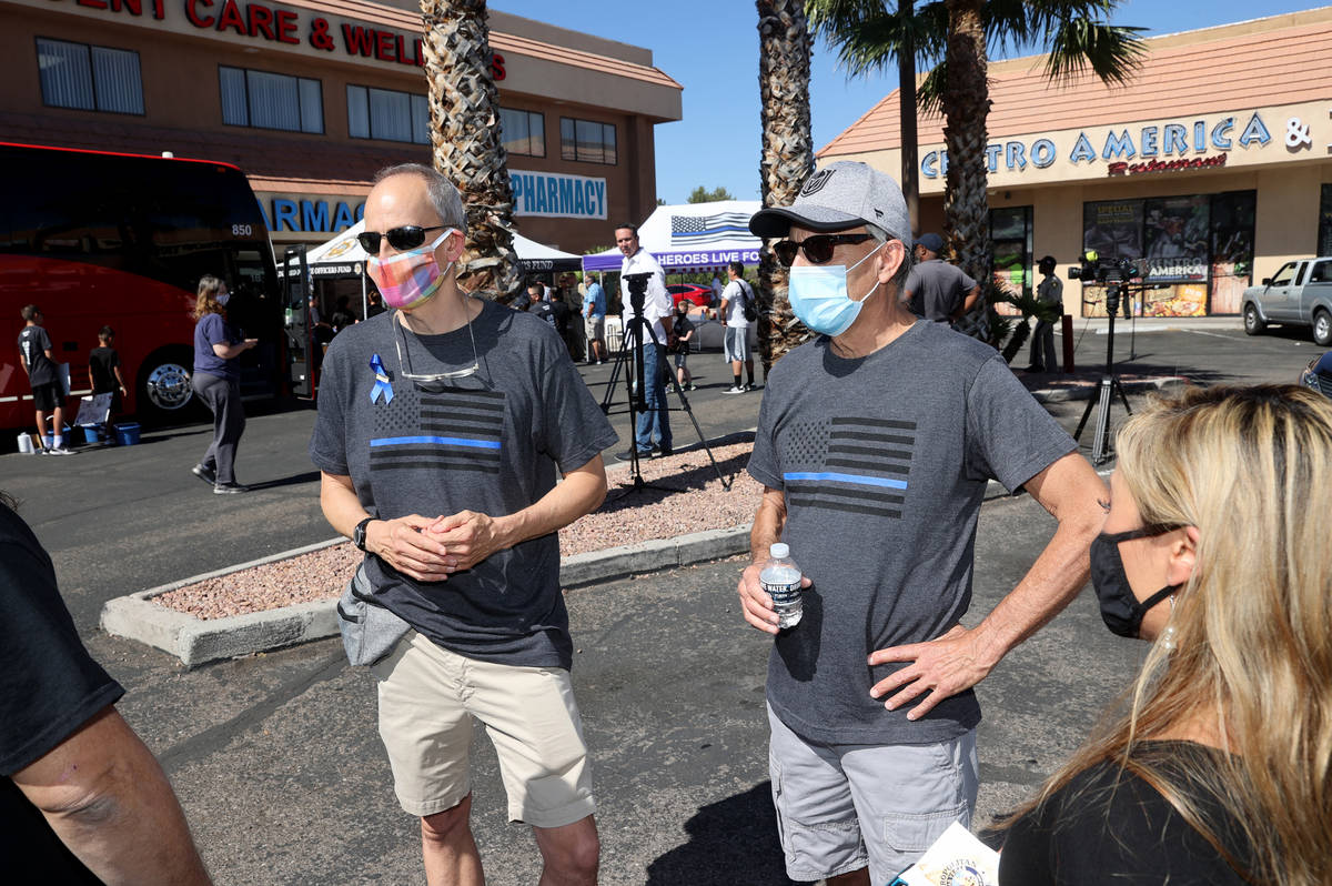 Guy Mikalonis, right, father of Las Vegas police officer Shay Mikalonis and his brother Frank M ...