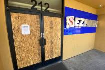 The EZ Pawn on Las Vegas Boulevard that was looted during protests on May 30 is boarded up on E ...
