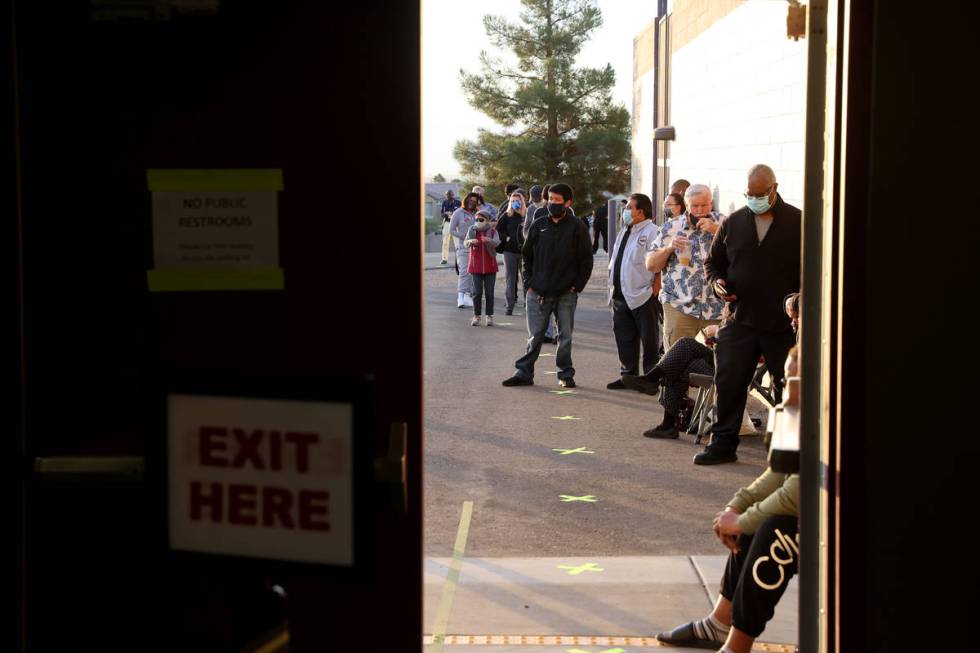 People wait to vote at 6:29 a.m. for the polls to open at 7 a.m. at Desert Breeze Community Cen ...