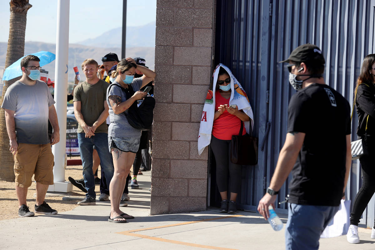 People line up to vote at Desert Breeze Community Center in Las Vegas on Election Day Tuesday, ...