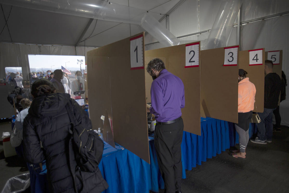 Voters check in to cast their ballots at the Las Vegas Ballpark voting site on Election Day, Tu ...