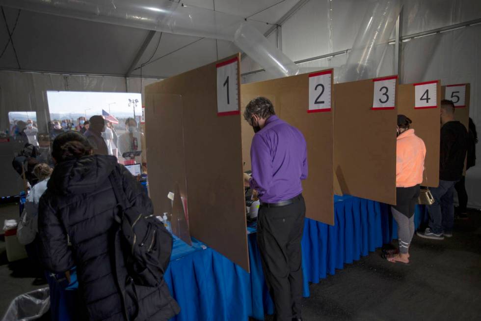 Voters check in to cast their ballots at the Las Vegas Ballpark voting site on Election Day, Tu ...