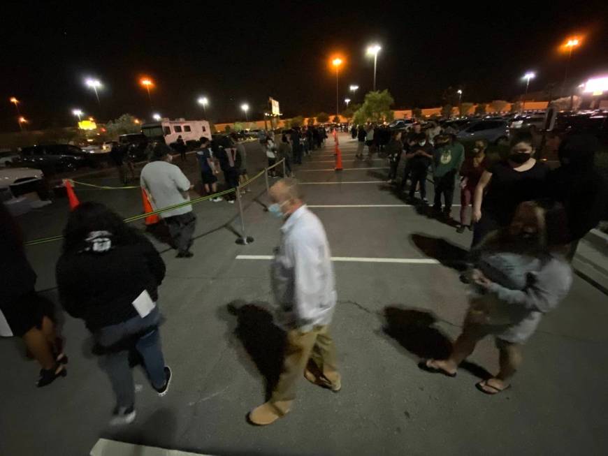 People wait in line to cast their vote at Las Vegas Athletic Clubs on Rainbow Road in Las Vegas ...