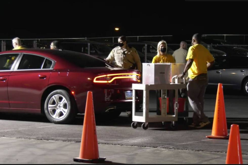 The first 2020 ballots arrived shortly after 8 p.m. at the Clark County Election Center for tab ...